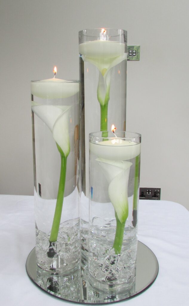 Trio of Cylinder Candle Vase centrepieces hire - myweddinghire.com